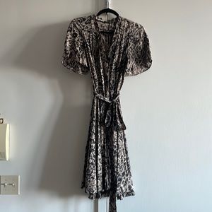 Feminine fit and flare short flutter sleeve printed dress with tie